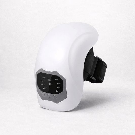 Cordless knee massager device with control panel for adjustable heat and massage settings.